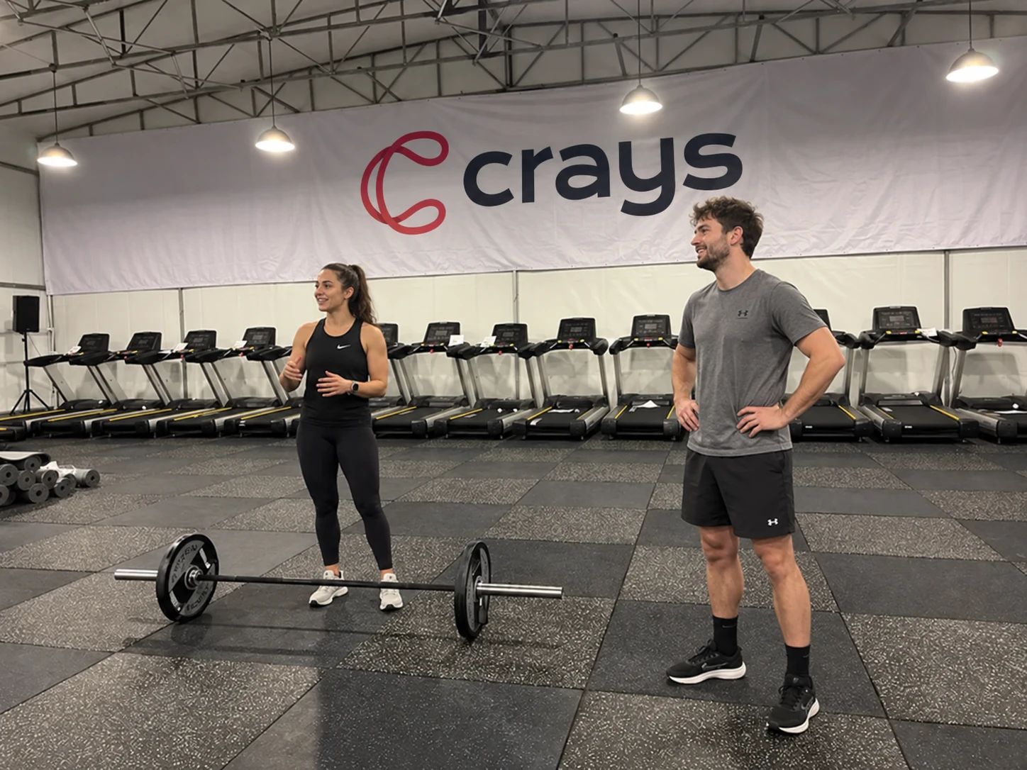 Two people training together in the gym