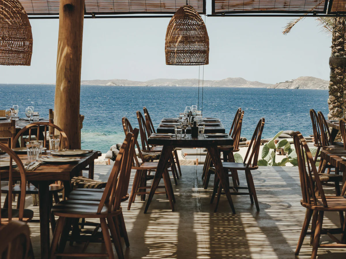 An open-air seaside table in a tropical setting