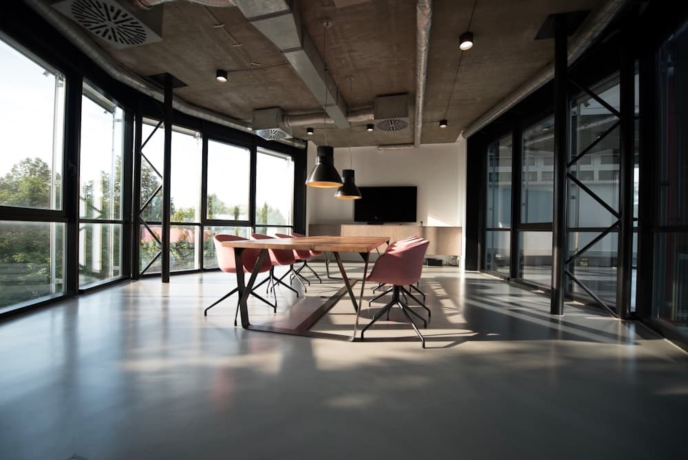 A quiet shared work room with daylight and flexible tables