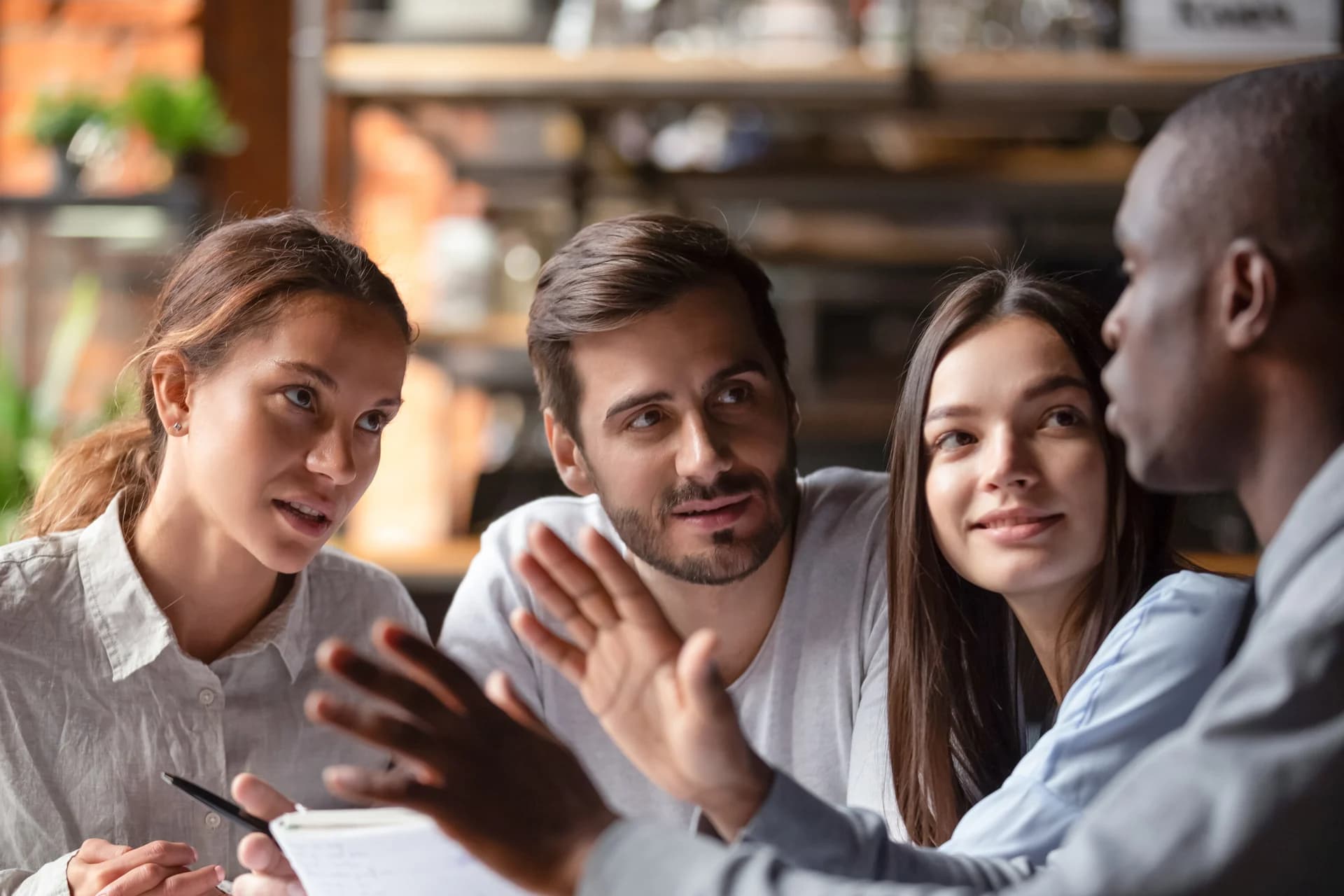 A company group working together around a shared table