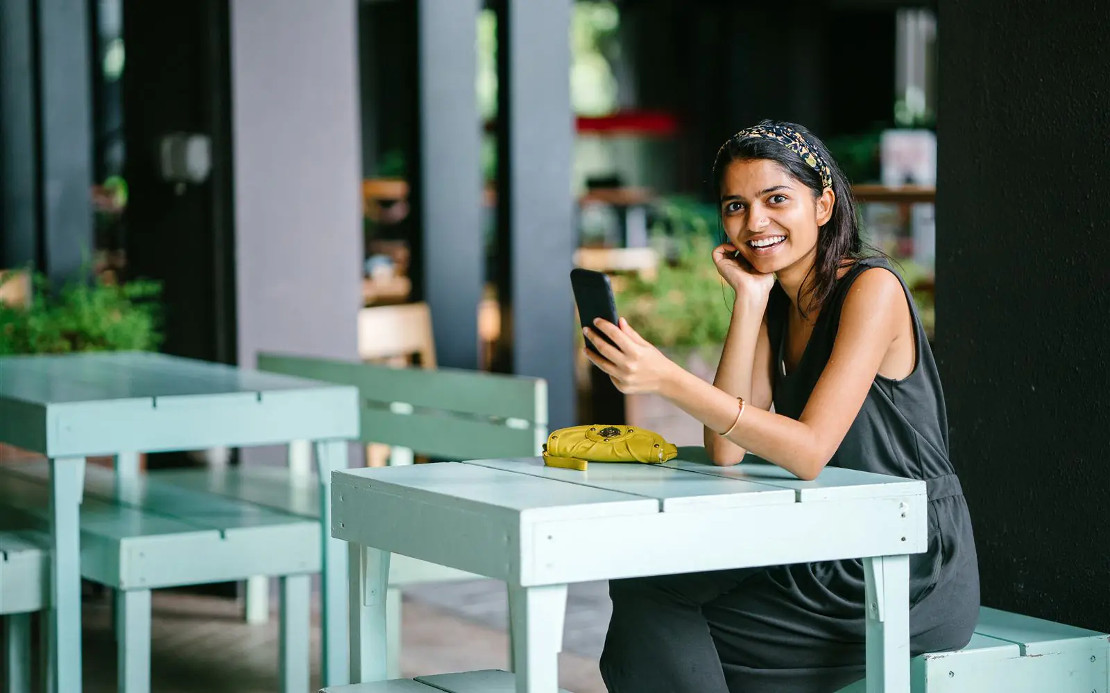 Founder and guest working from a stylish destination cafe