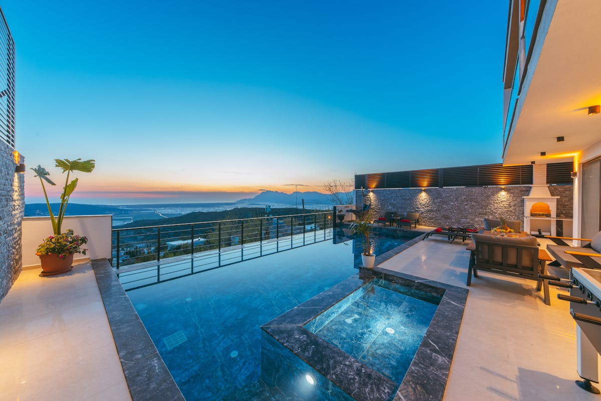 Destination hospitality asset with pool terrace and view