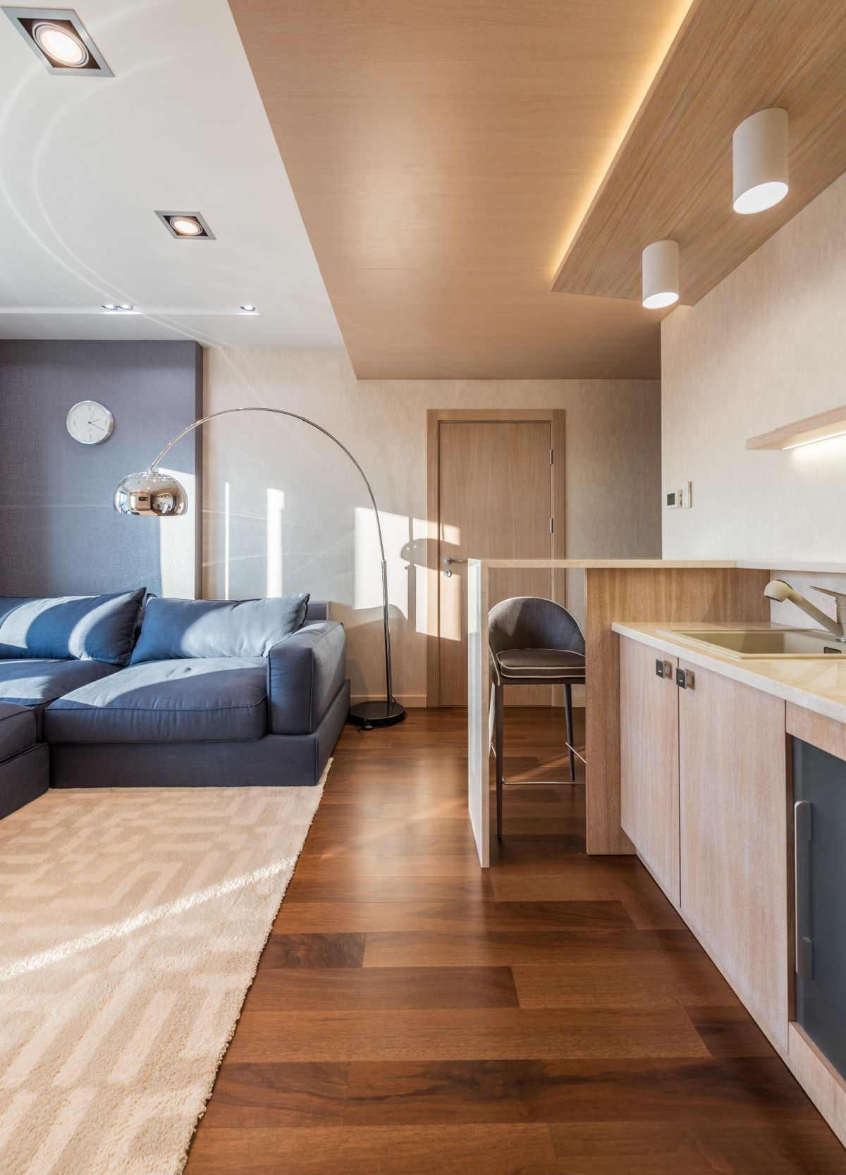 Compact serviced apartment interior for an extended-stay retrofit